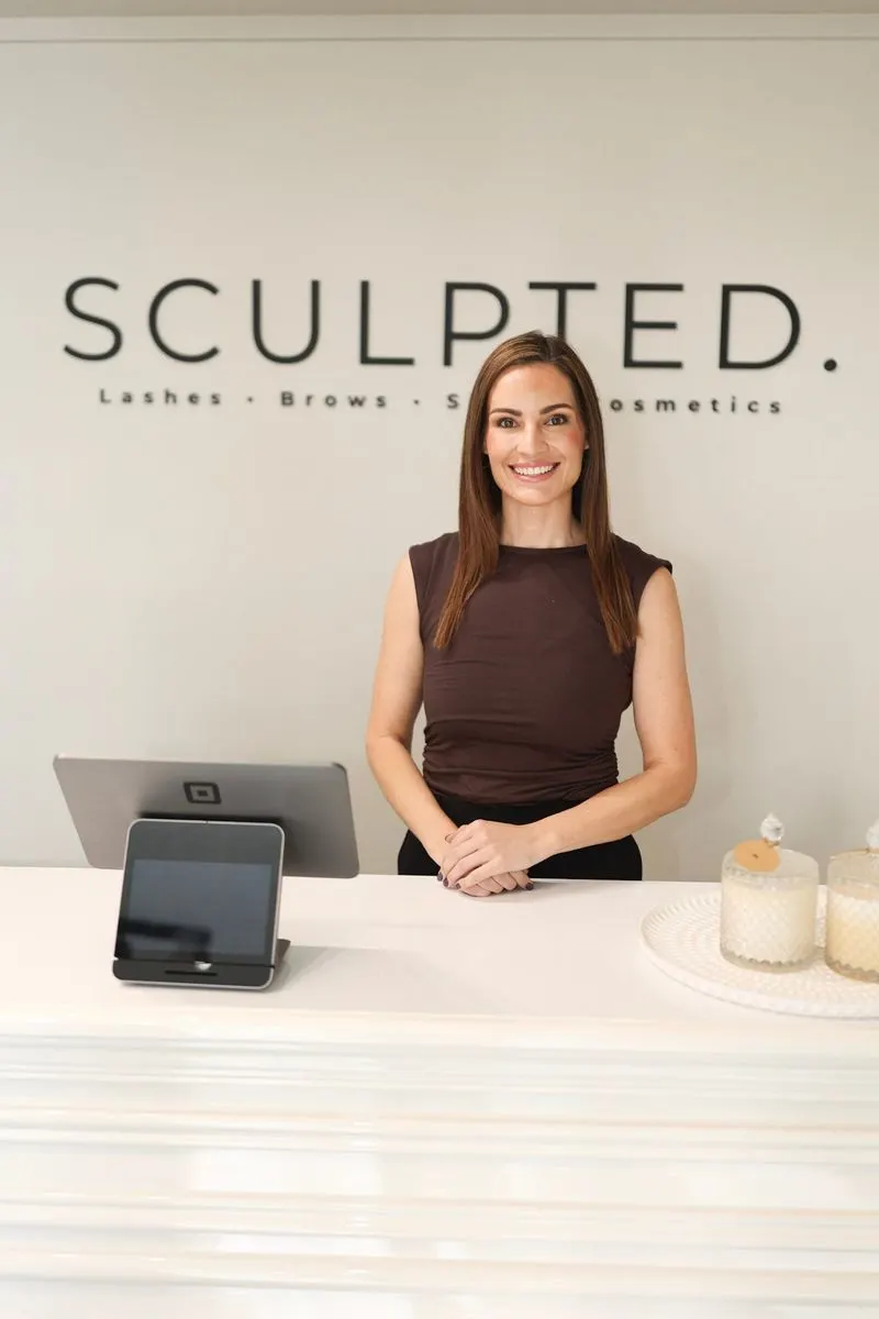 Emily at the Sculpted front desk